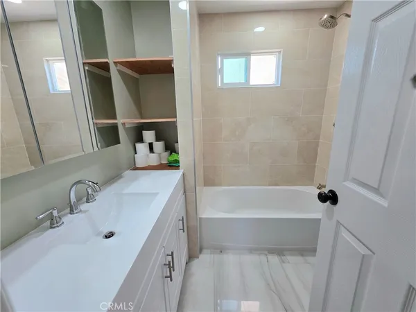 a bathroom with a sink and a tub