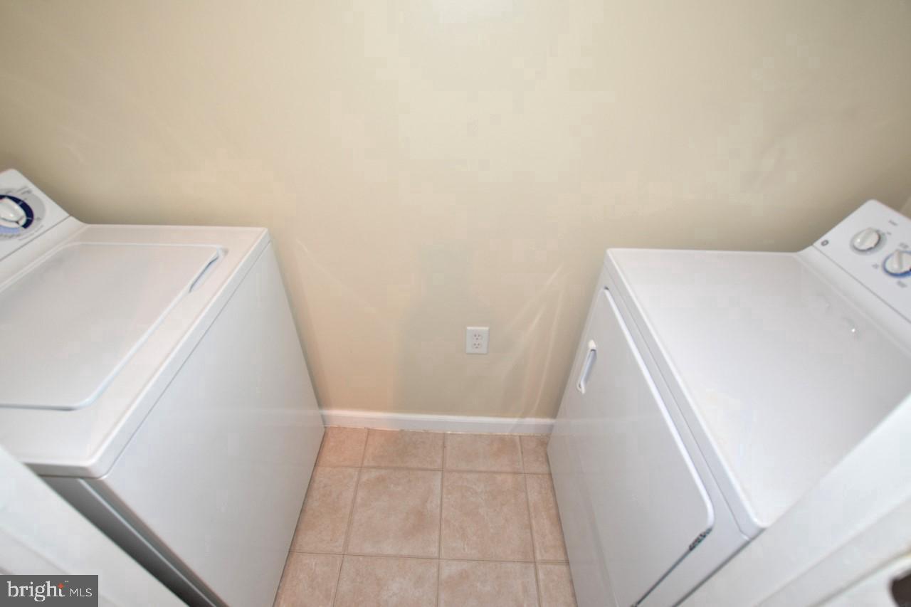 508 Sunset View Terrace Southeast, Unit 205 Leesburg, VA 20175 - Photo 23 of 28 a utility room with dryer and washer