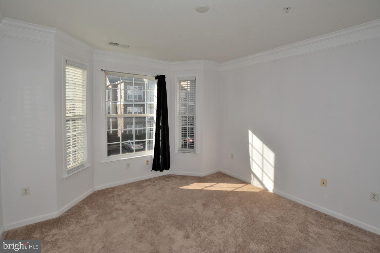 508 Sunset View Terrace Southeast, Unit 205 Leesburg, VA 20175 - Photo 24 of 28 a view of an empty room with a window