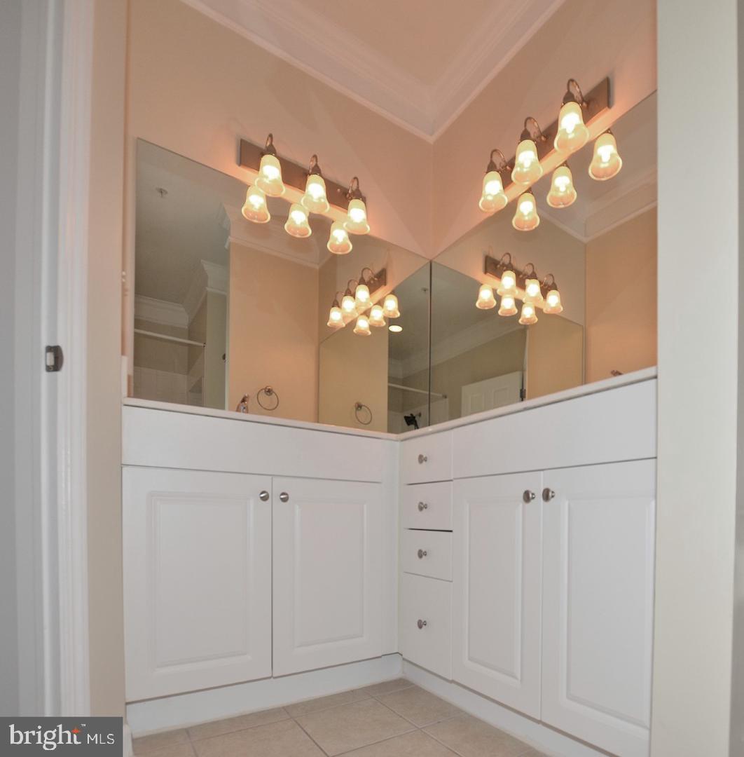 508 Sunset View Terrace Southeast, Unit 205 Leesburg, VA 20175 - Photo 9 of 28 a view of a hallway with chandelier
