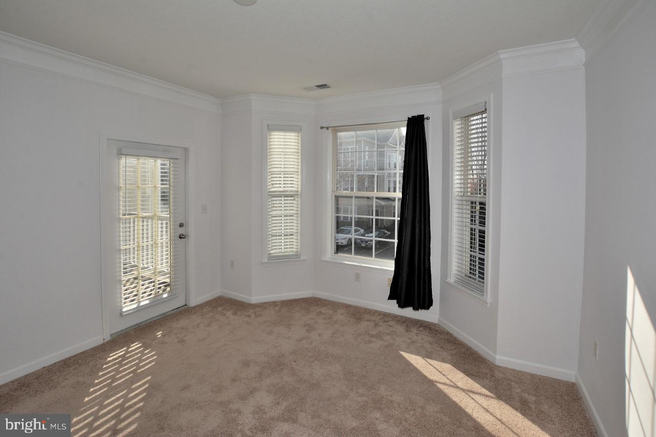 508 Sunset View Terrace Southeast, Unit 205 Leesburg, VA 20175 - Photo 10 of 28 a view of an empty room with a window