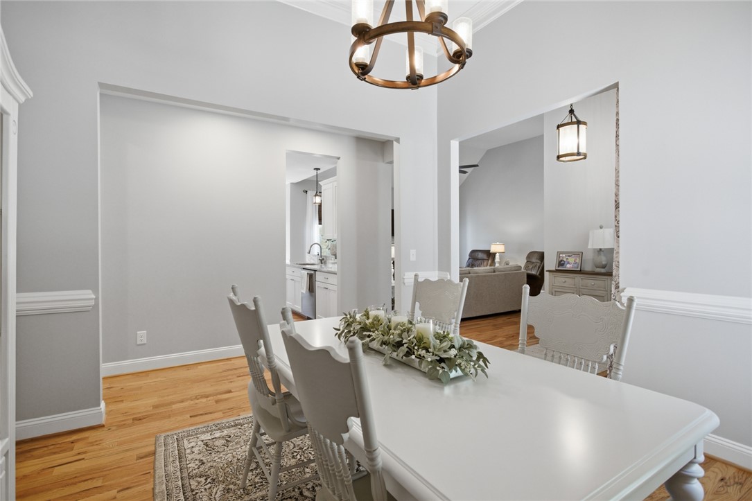 105 Winterbrook Circle Seneca, SC 29678 - Photo 18 of 48 This bright dining area features an open concept layout and elegant hardwood flooring.