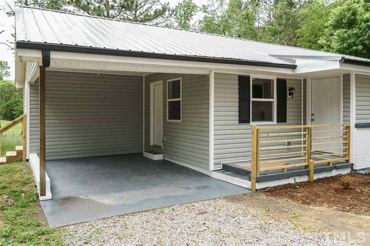 1421 Creech Road Garner, NC 27529 - Photo 15 of 23 a view of a house with a yard