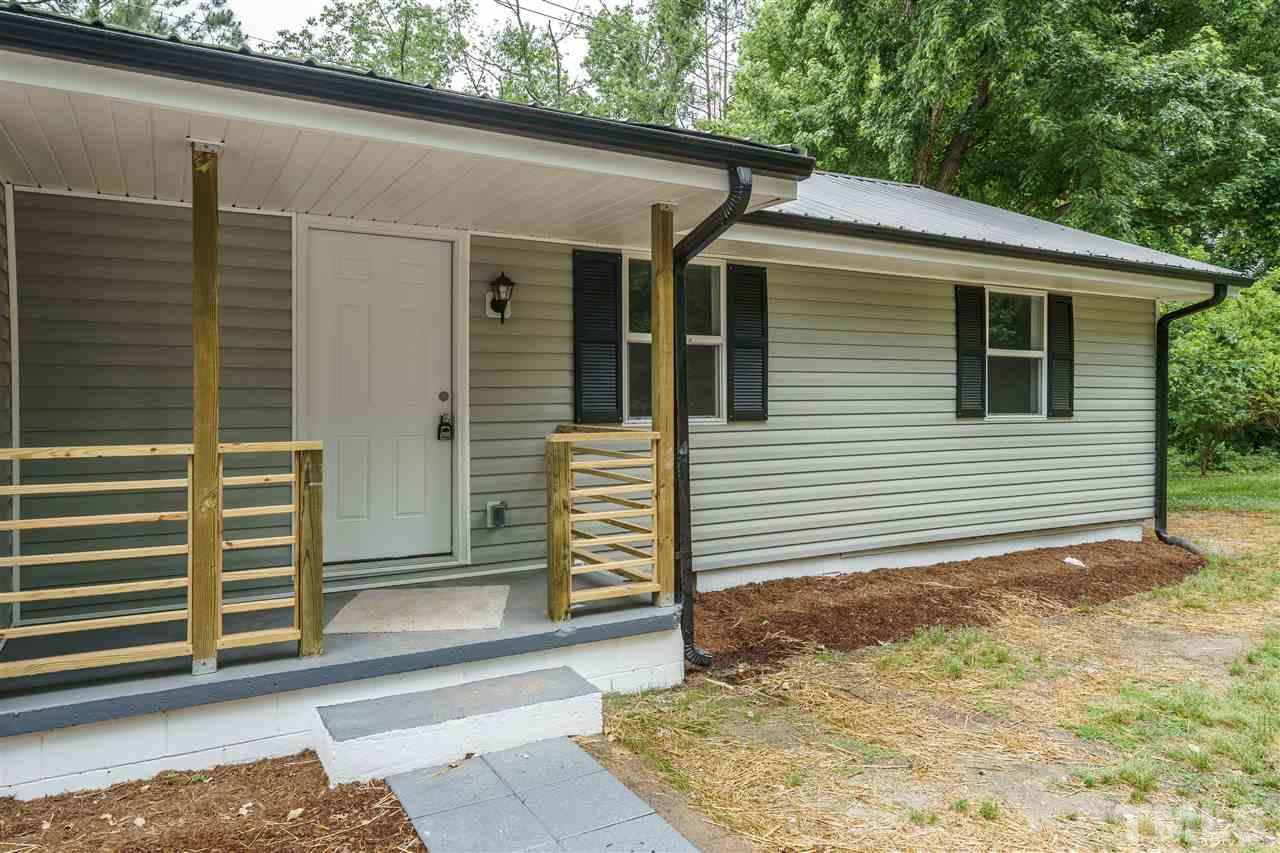 1421 Creech Road Garner, NC 27529 - Photo 3 of 23 a view of a back yard of the house