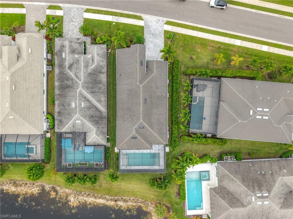 8980 Mustique Lane Naples, FL 34114 - Photo 15 of 50 Aerial view of a pool