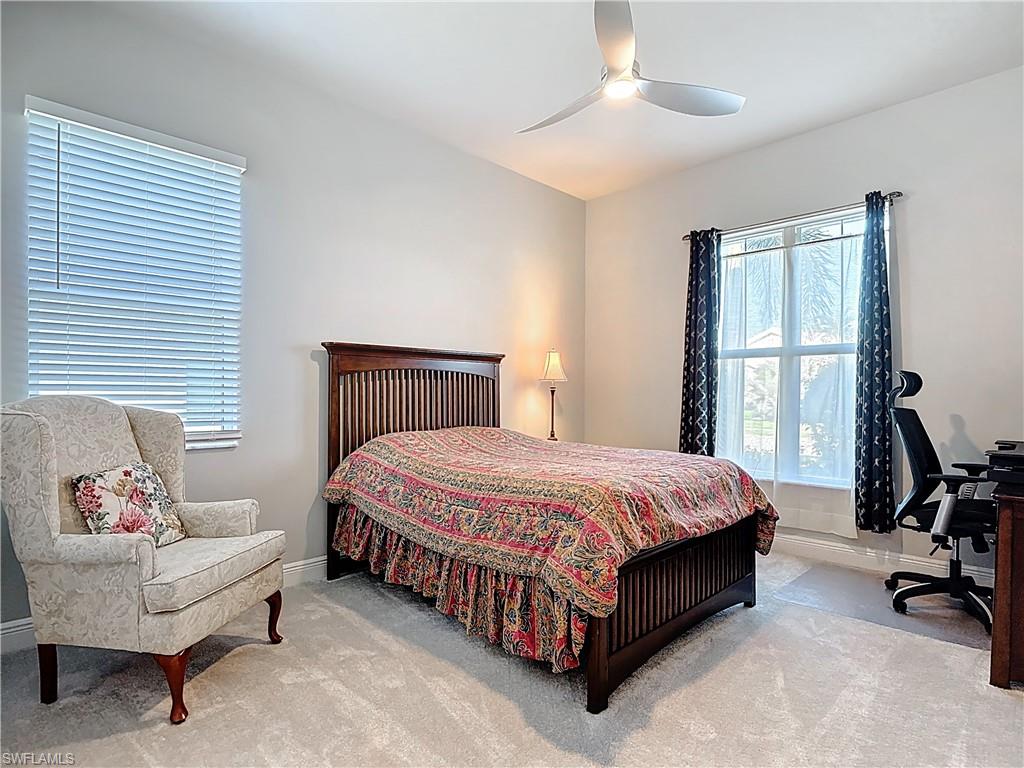 8980 Mustique Lane Naples, FL 34114 - Photo 33 of 50 Carpeted bedroom with ceiling fan and a desk