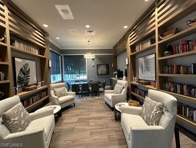 8980 Mustique Lane Naples, FL 34114 - Photo 44 of 50 Living area featuring ornamental molding and recessed lighting