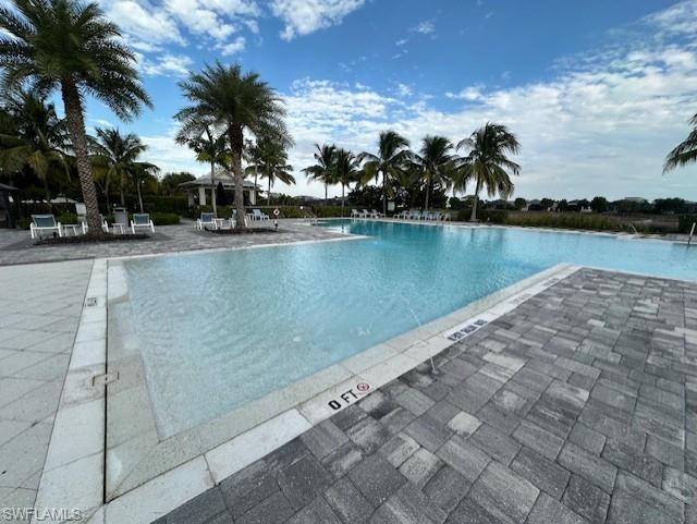 8980 Mustique Lane Naples, FL 34114 - Photo 45 of 50 Community pool with a patio
