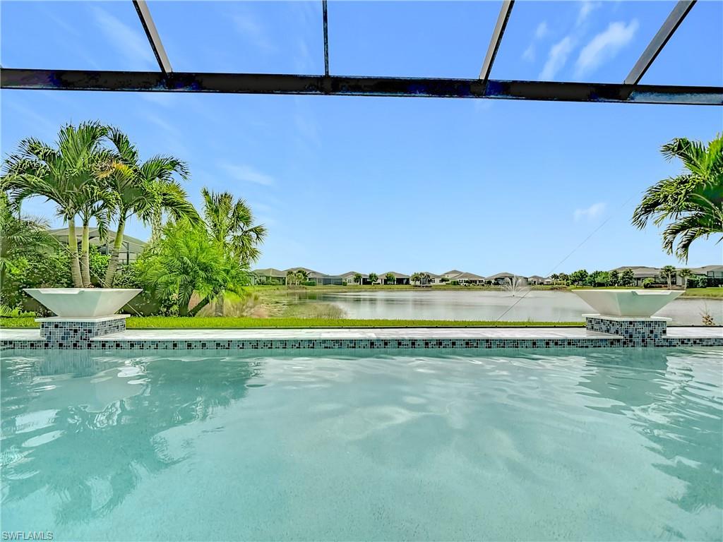 8980 Mustique Lane Naples, FL 34114 - Photo 8 of 50 Swimming pool featuring a water view