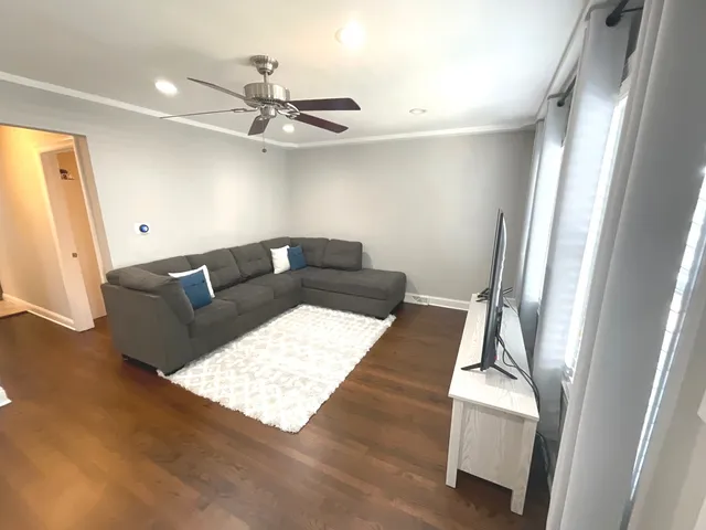 a living room with furniture and a rug