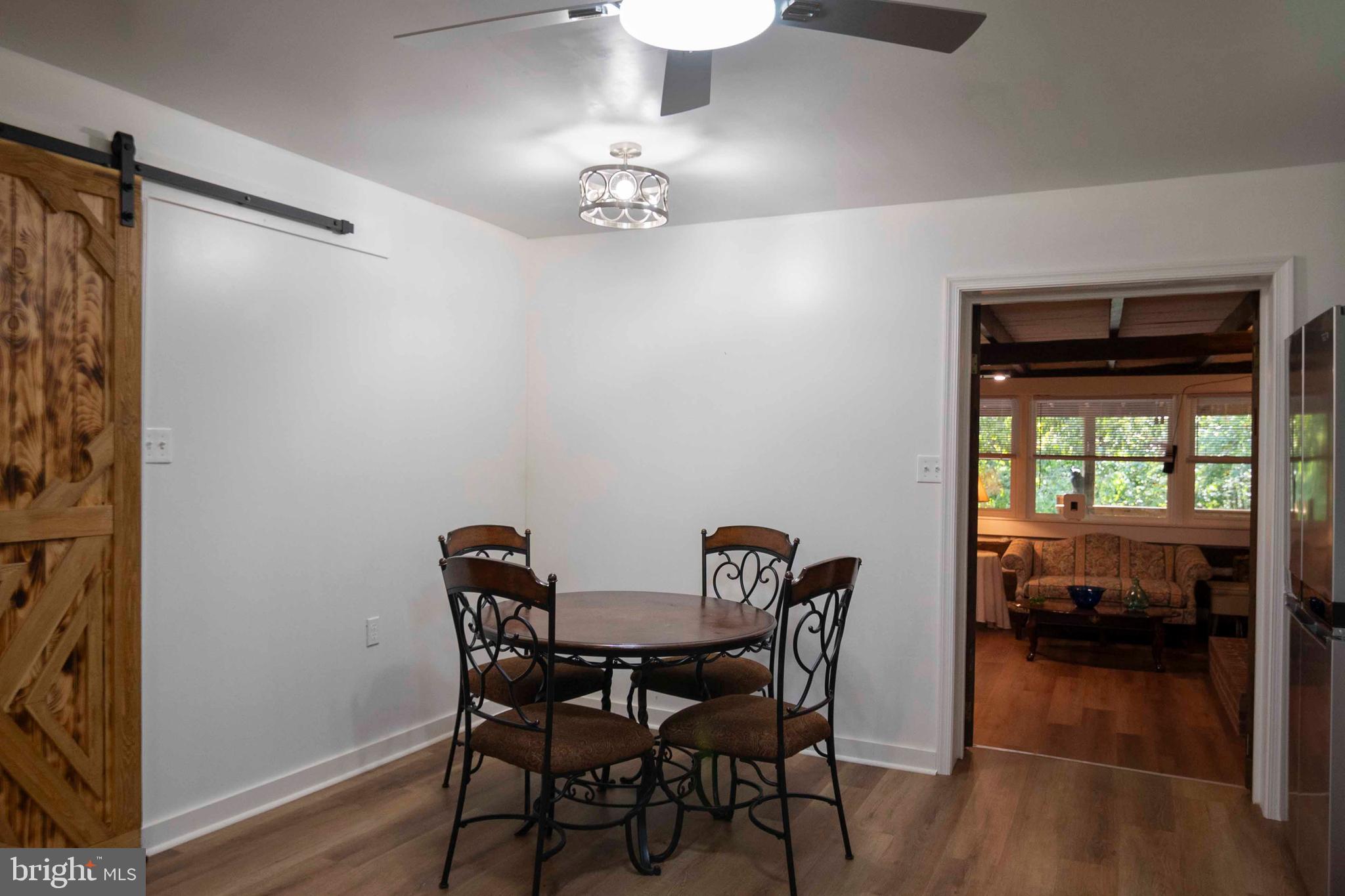 2002 Balkamore Hill Road Stanley, VA 22851 - Photo 12 of 36 a view of a dining room with furniture window and wooden floor