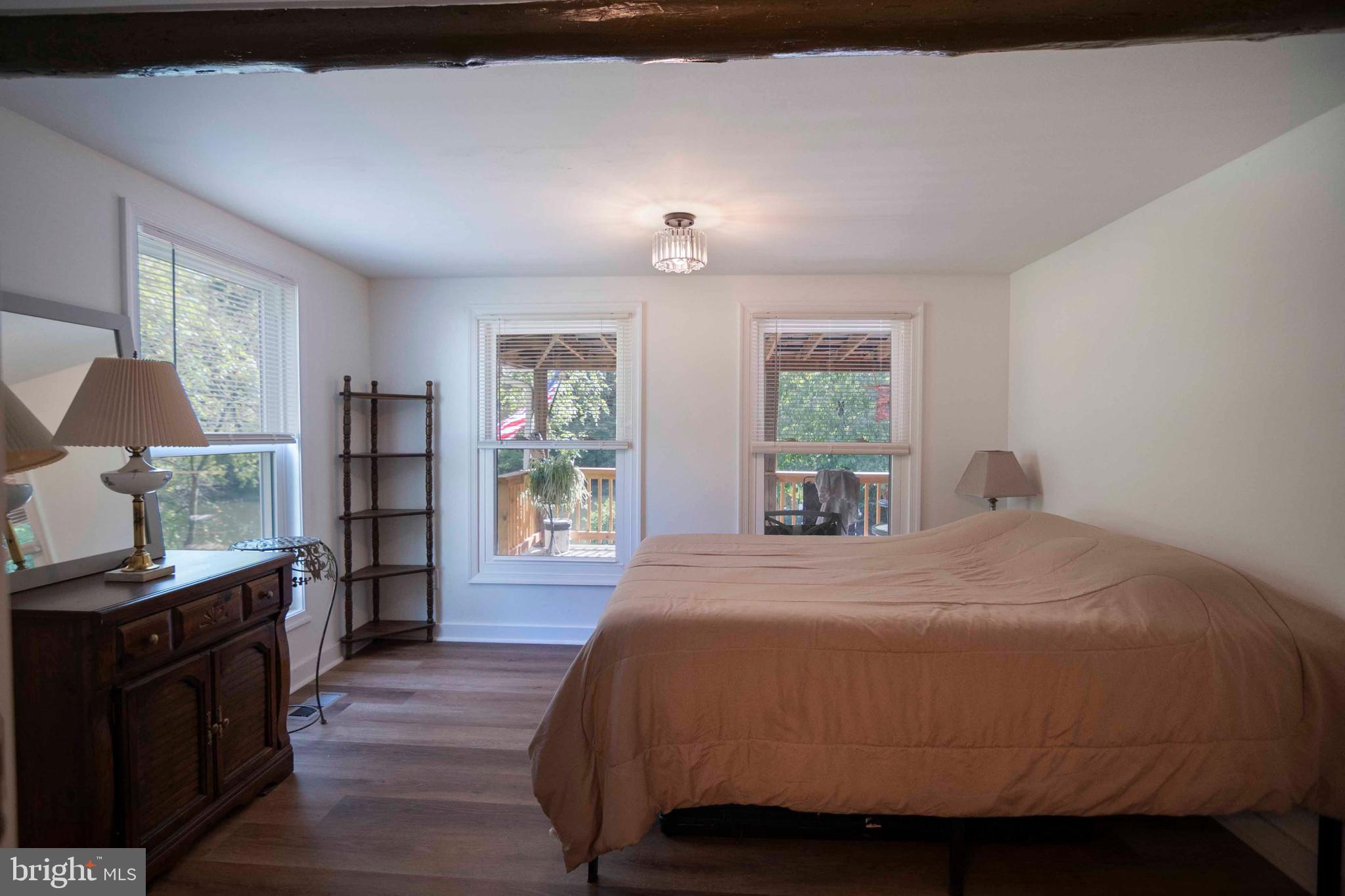 2002 Balkamore Hill Road Stanley, VA 22851 - Photo 17 of 36 a bedroom with a bed and wooden floor
