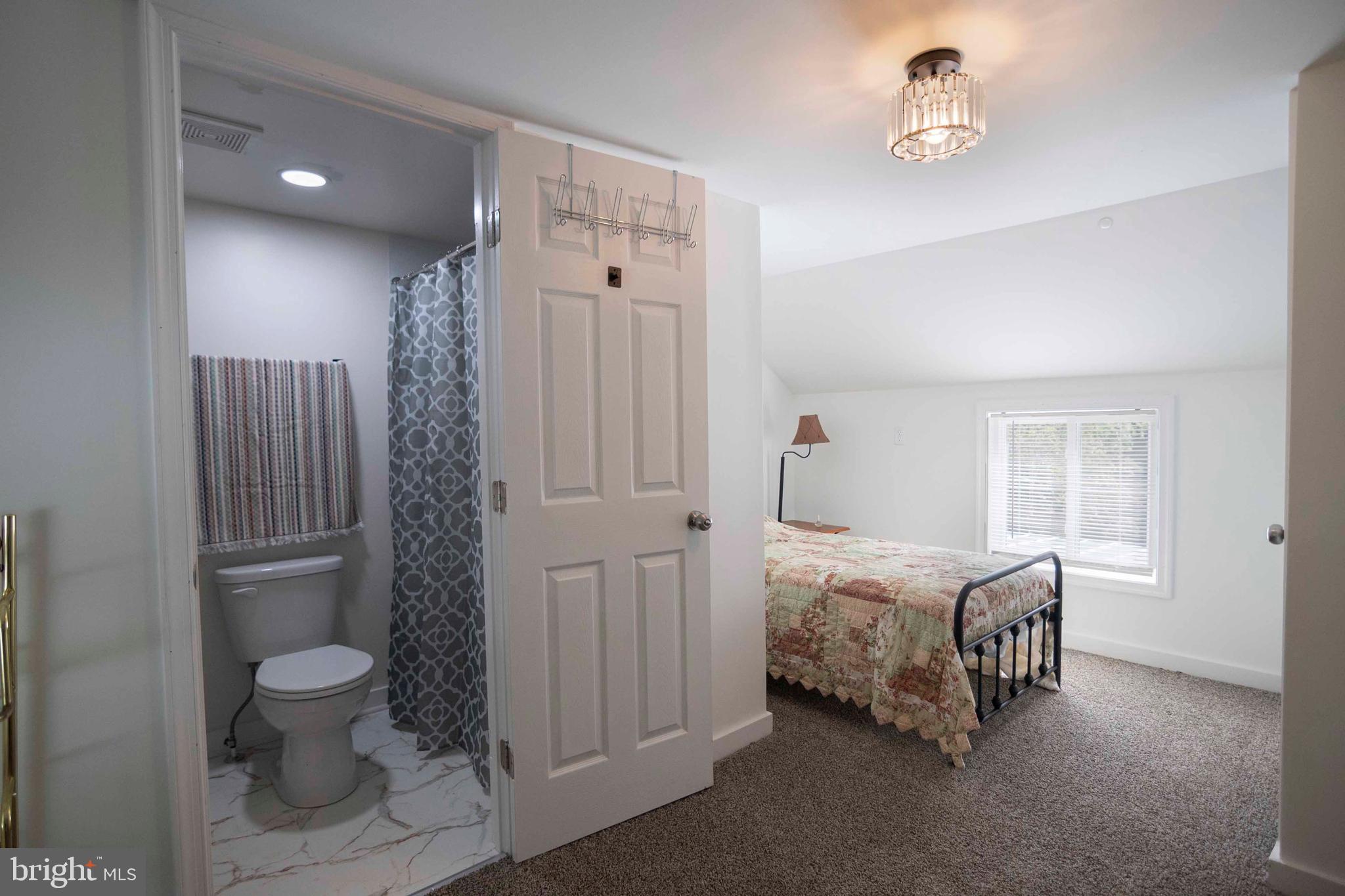 2002 Balkamore Hill Road Stanley, VA 22851 - Photo 20 of 36 a bedroom with a bed and a table
