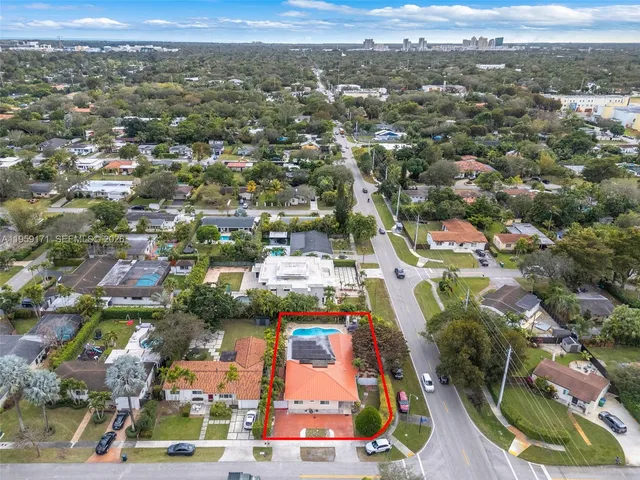 an aerial view of residential houses with outdoor space