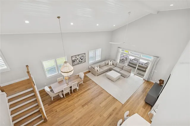 a kitchen with stainless steel appliances kitchen island a refrigerator sink and cabinets