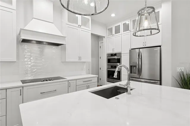a kitchen with a table chairs and couches