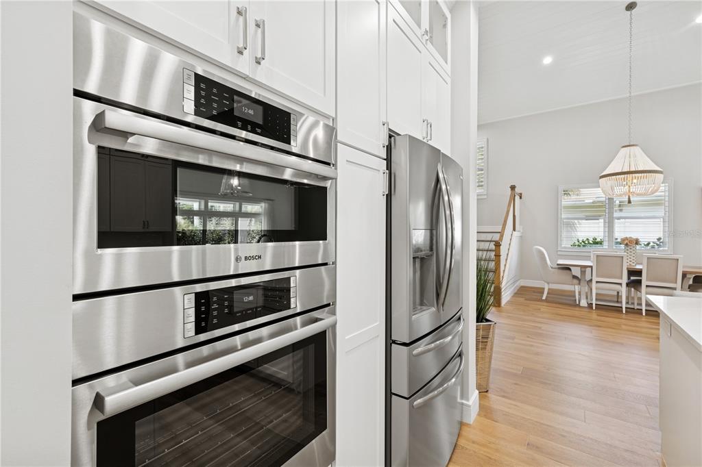 4013 Red Rock Lane Sarasota, FL 34231 - Photo 15 of 60 a kitchen with stainless steel appliances and white cabinets
