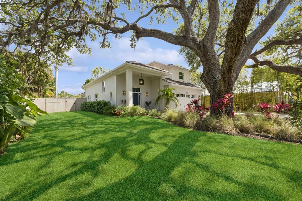 4013 Red Rock Lane Sarasota, FL 34231 - Photo 2 of 60 a front view of a house with garden