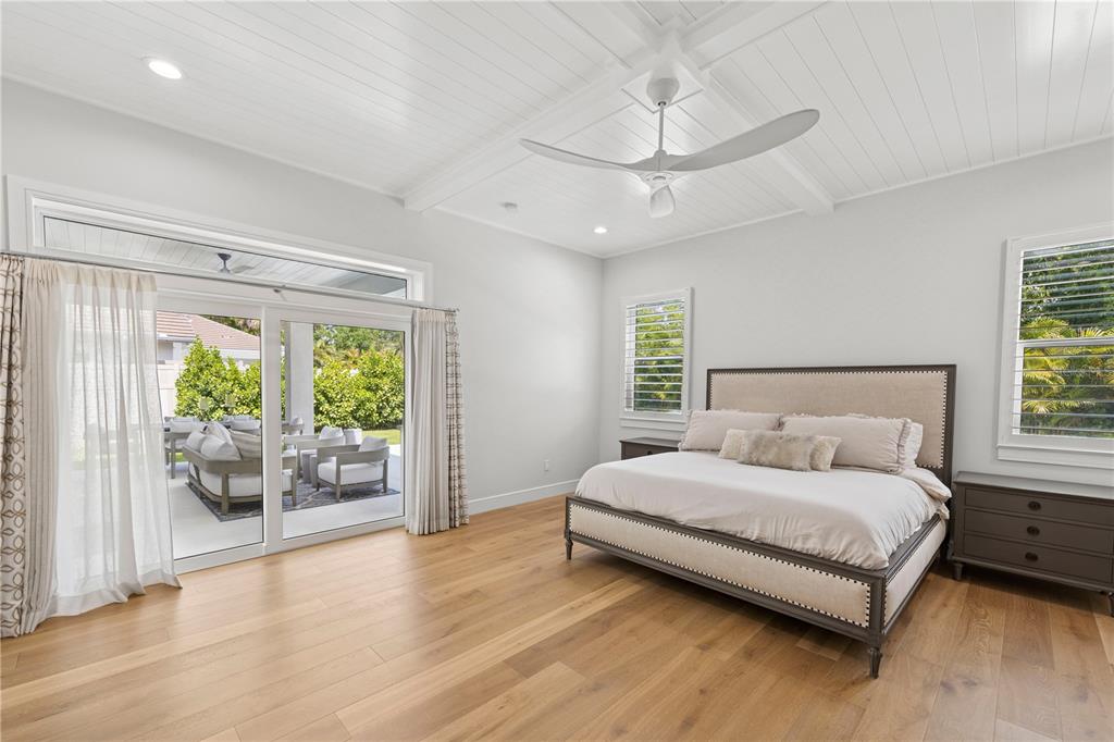 4013 Red Rock Lane Sarasota, FL 34231 - Photo 25 of 60 a bedroom with a bed and a large window