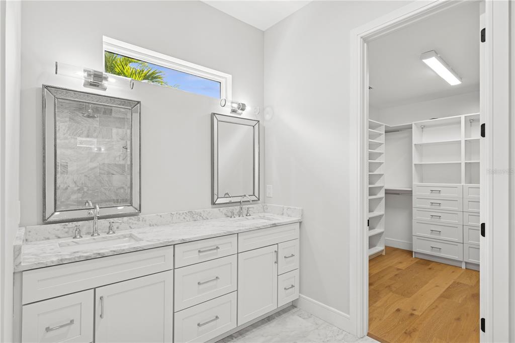 4013 Red Rock Lane Sarasota, FL 34231 - Photo 27 of 60 a bathroom with a granite countertop sink and a mirror