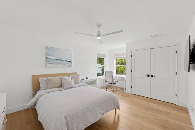 a bedroom with a bed and a chair