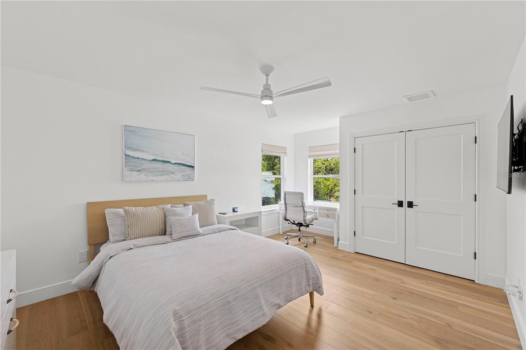 4013 Red Rock Lane Sarasota, FL 34231 - Photo 33 of 60 a bedroom with a large bed and a window