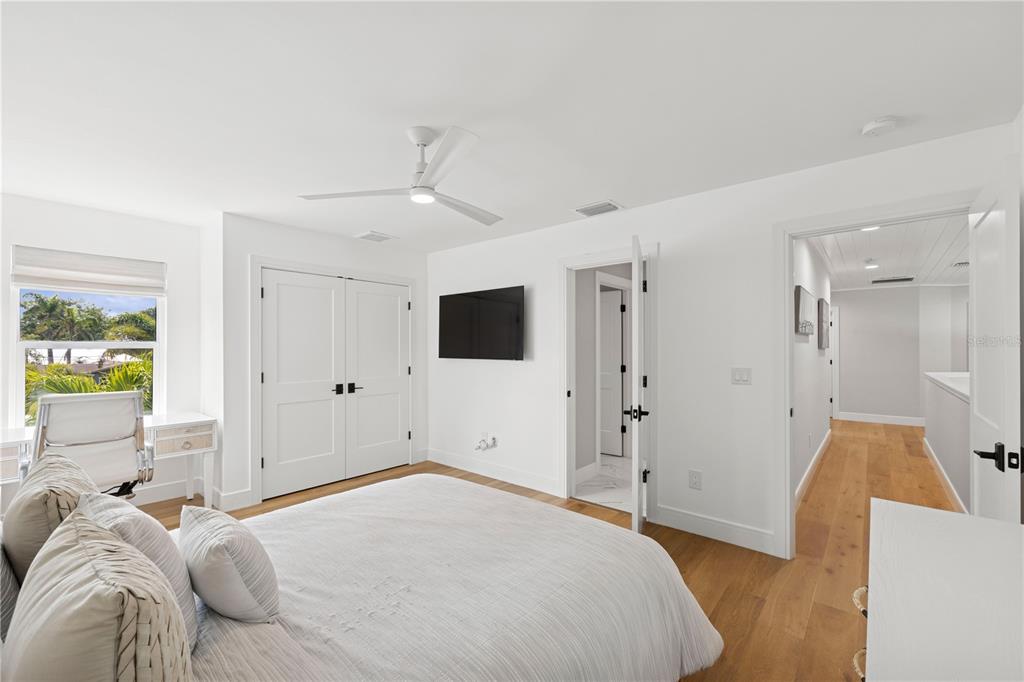 4013 Red Rock Lane Sarasota, FL 34231 - Photo 34 of 60 a bedroom with a bed and a couch