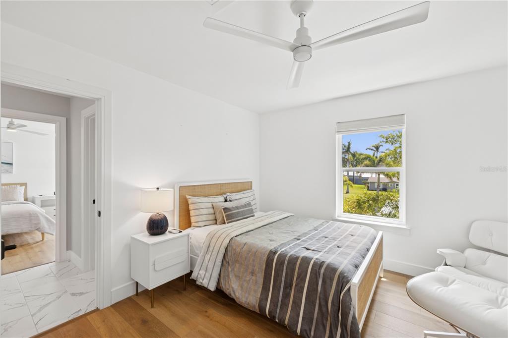 4013 Red Rock Lane Sarasota, FL 34231 - Photo 35 of 60 a bedroom with a bed and a window