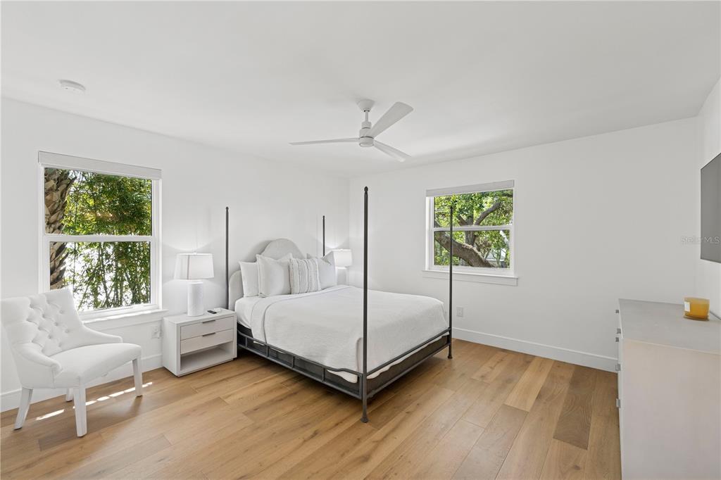 4013 Red Rock Lane Sarasota, FL 34231 - Photo 39 of 60 a bedroom with a bed and a chair