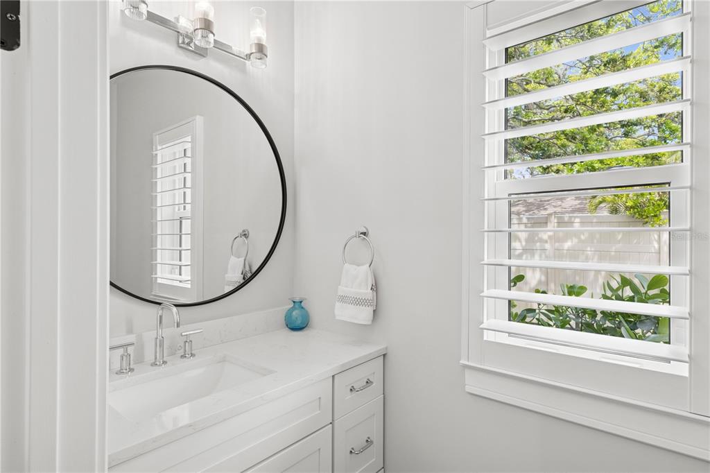 4013 Red Rock Lane Sarasota, FL 34231 - Photo 45 of 60 a bathroom with a sink and a mirror