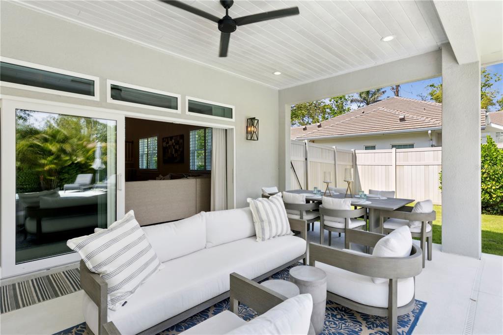 4013 Red Rock Lane Sarasota, FL 34231 - Photo 50 of 60 a living room with furniture and a large window
