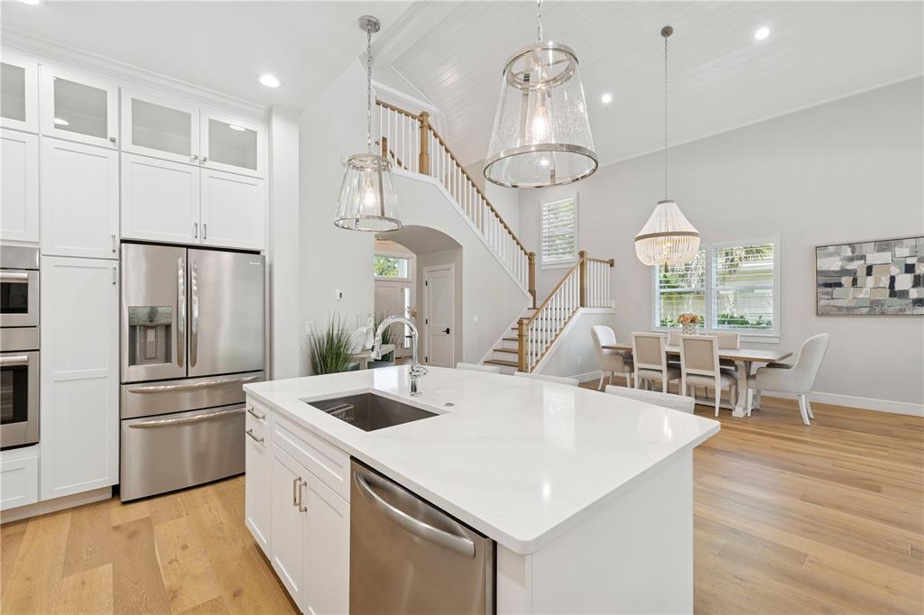 4013 Red Rock Lane Sarasota, FL 34231 - Photo 5 of 60 a kitchen that has a lot of cabinets a sink and appliances