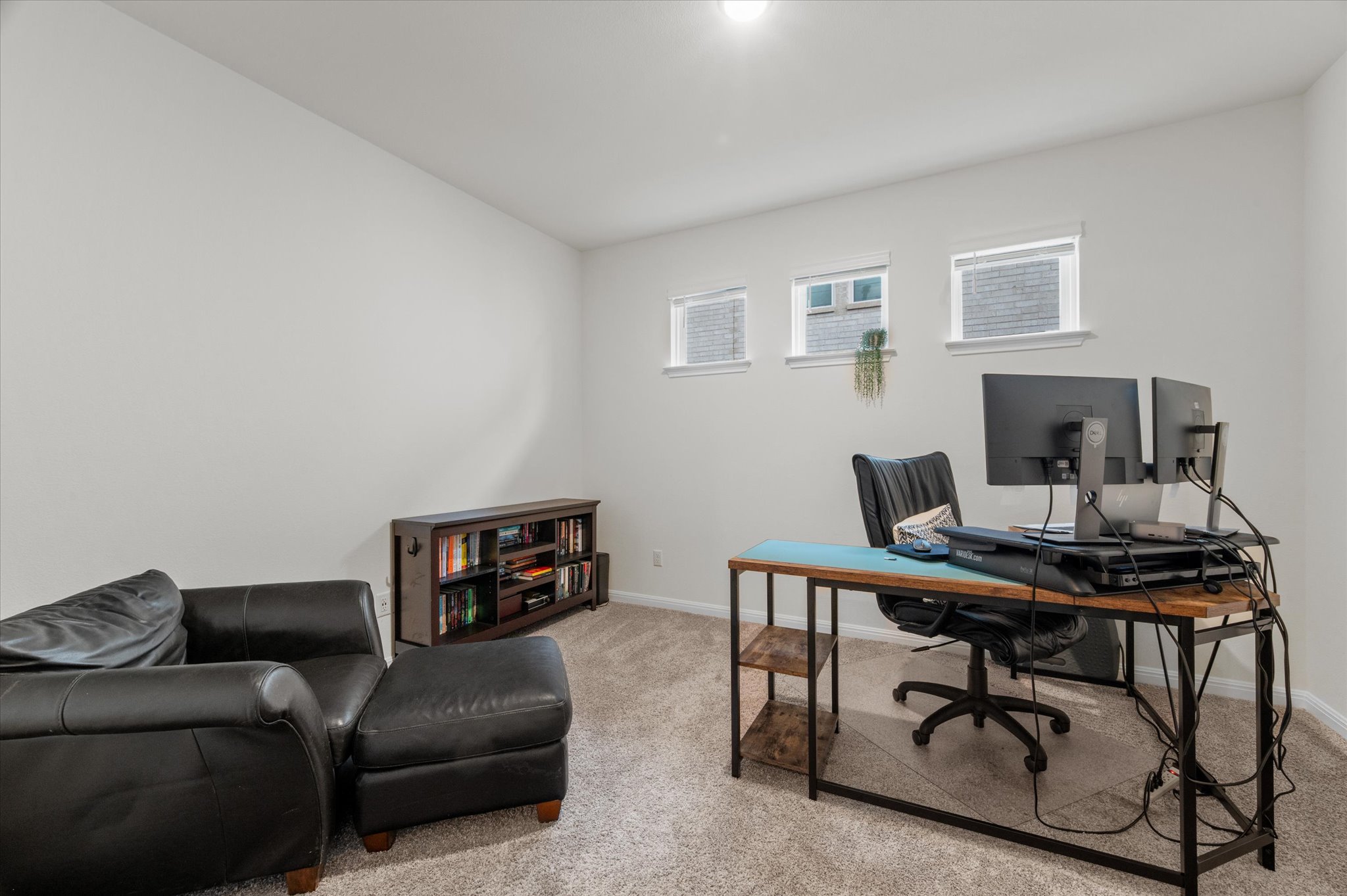 111 Beryl Way Dripping Springs, TX 78620 - Photo 13 of 26 a livingroom with workspace and a couch