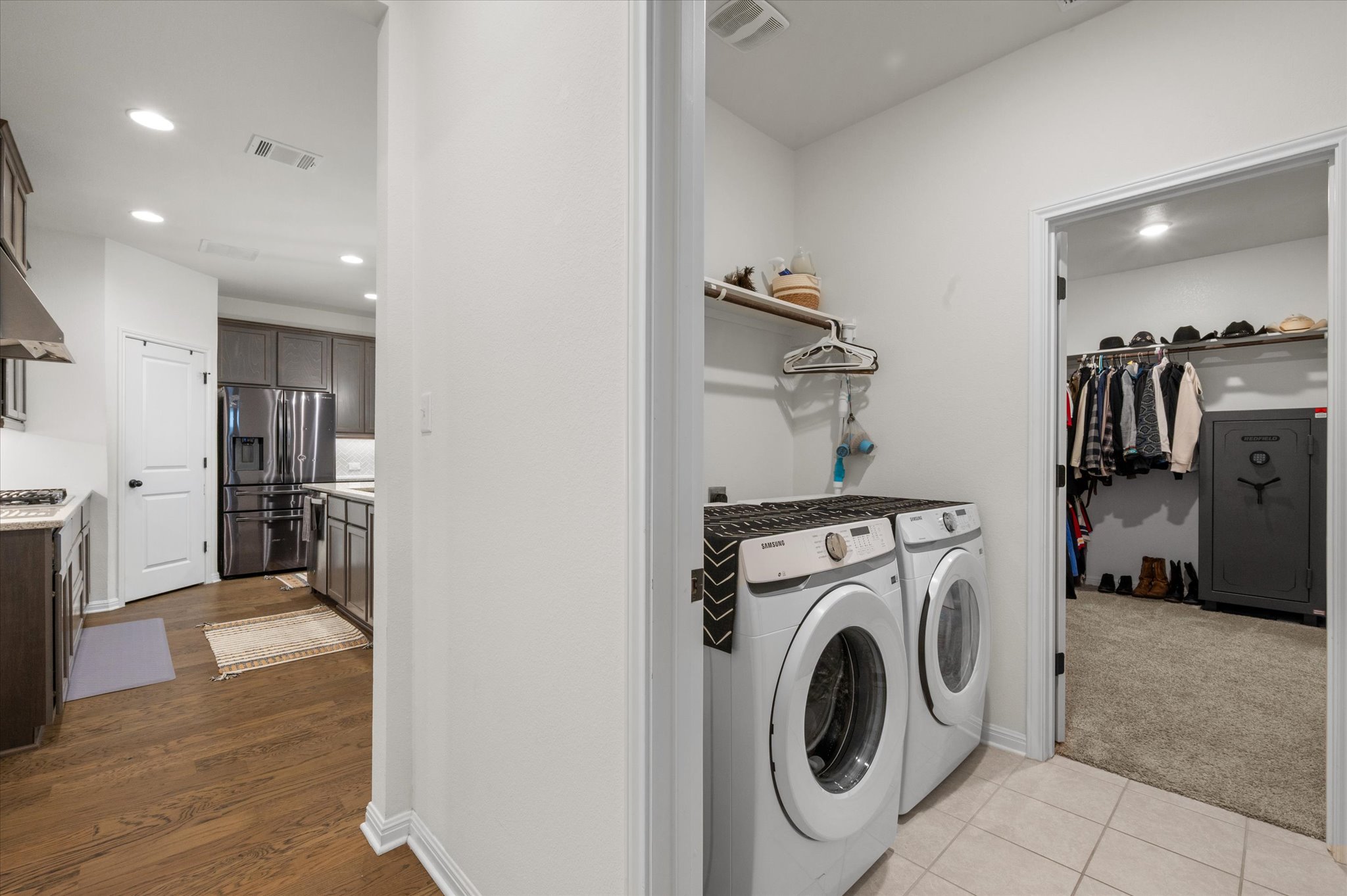 111 Beryl Way Dripping Springs, TX 78620 - Photo 17 of 26 a view of a kitchen with refrigerator and washer