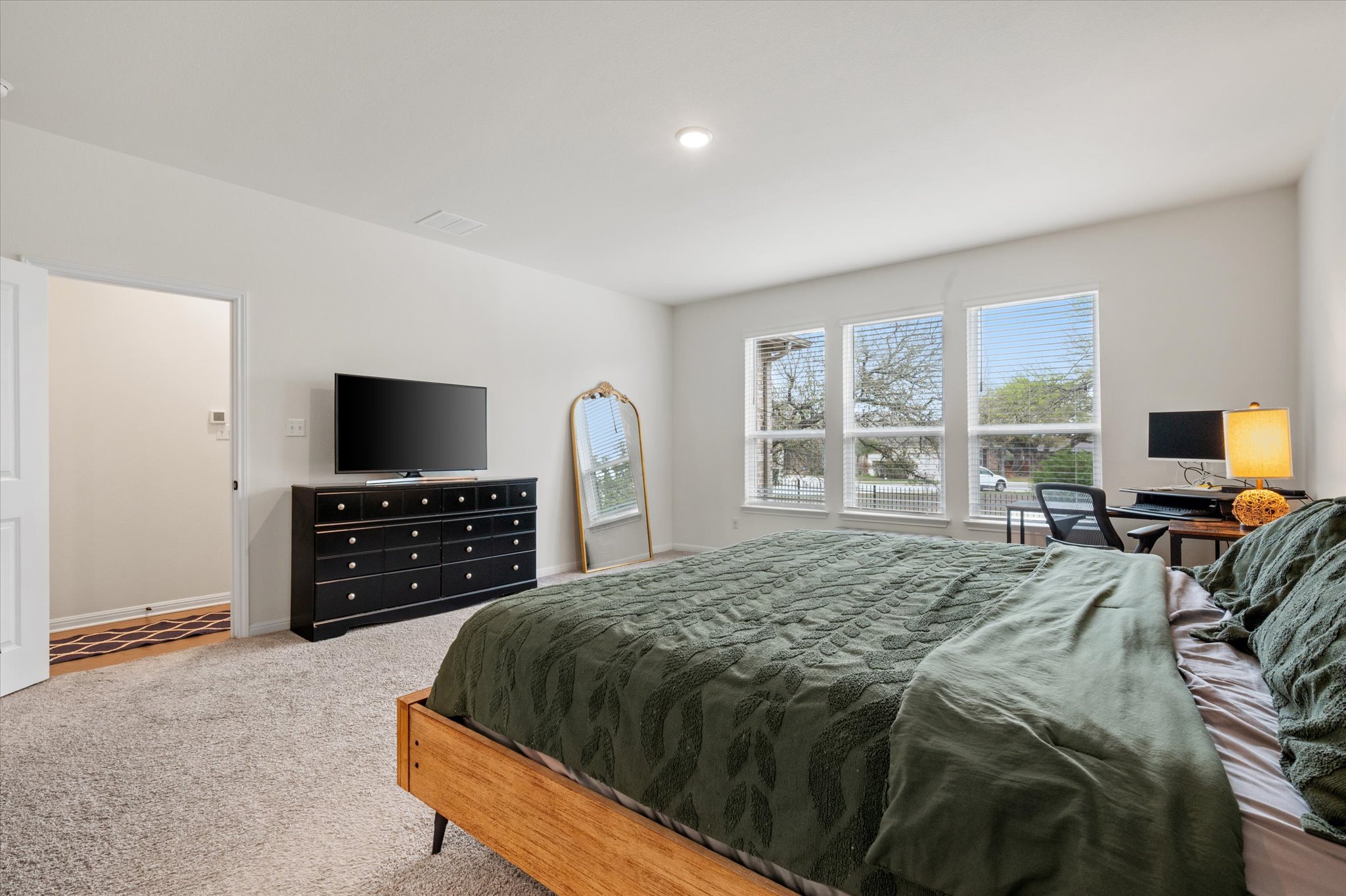 111 Beryl Way Dripping Springs, TX 78620 - Photo 9 of 26 a bedroom with a bed and television