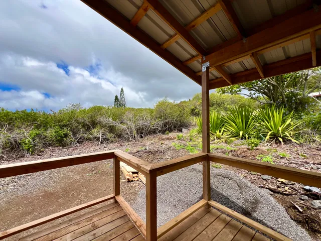 a view of a balcony with furniture