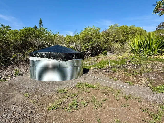 a view of a wooden house with a yard