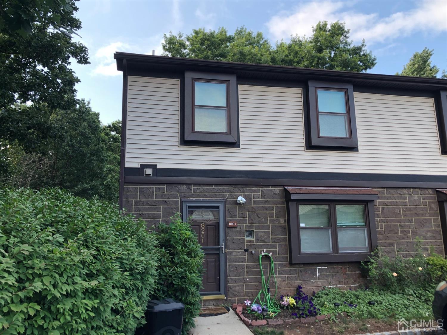 8201 Hana Road Edison, NJ 08817 - Photo 1 of 15 front view of a house with a yard