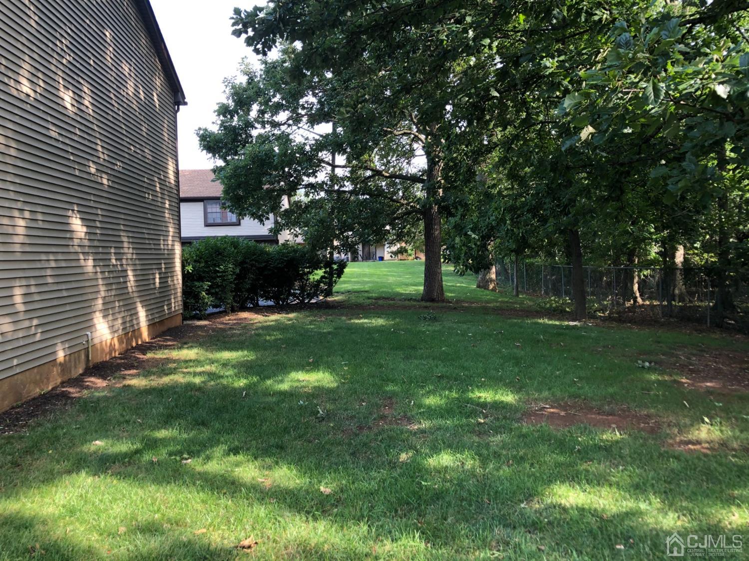 8201 Hana Road Edison, NJ 08817 - Photo 2 of 15 a view of a backyard with a garden