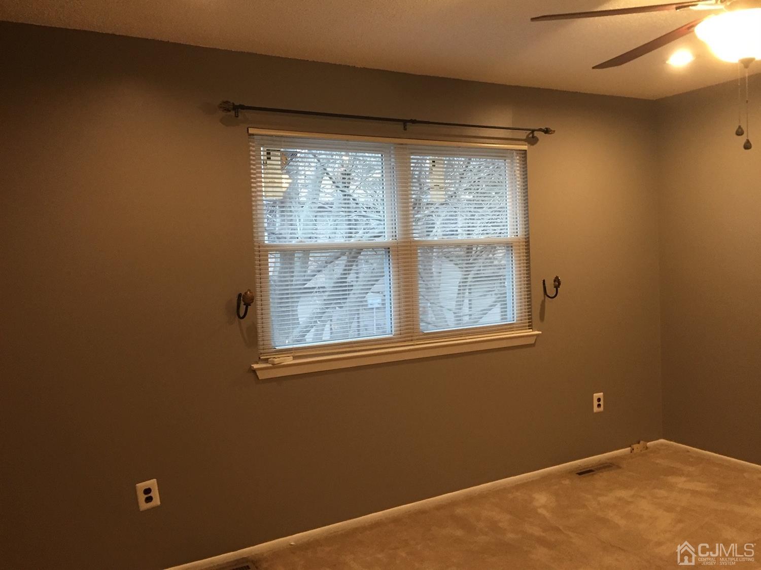 8201 Hana Road Edison, NJ 08817 - Photo 14 of 15 a view of an empty room with a window