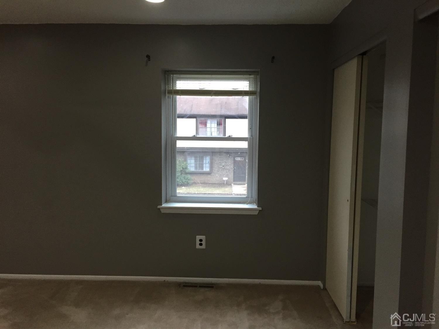 8201 Hana Road Edison, NJ 08817 - Photo 10 of 15 a view of an empty room with a window
