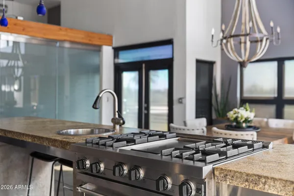 a kitchen with a stove and a sink