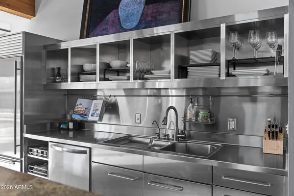 a kitchen with a sink and cabinets