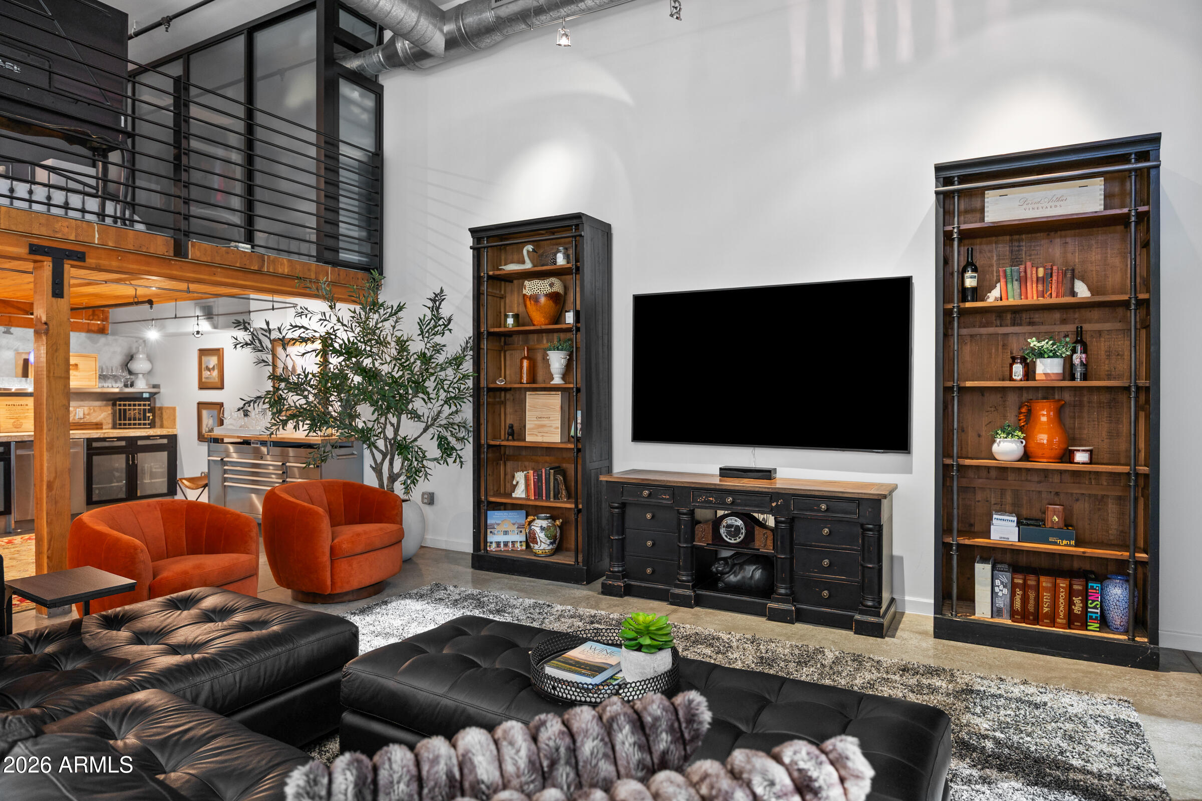 914 East Osborn Road, Unit 403 Phoenix, AZ 85014 - Photo 19 of 49 a living room with furniture and a flat screen tv