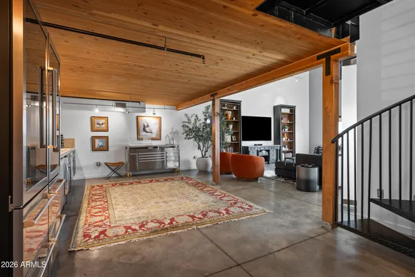 a kitchen with stainless steel appliances kitchen island granite countertop a stove and cabinets