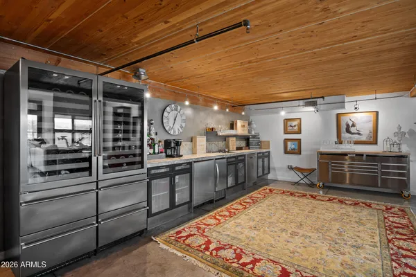 a kitchen with stainless steel appliances granite countertop a stove and cabinets