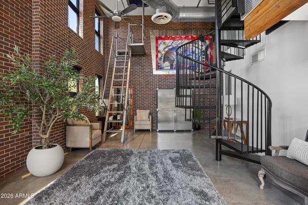 a view of a porch with chairs and backyard