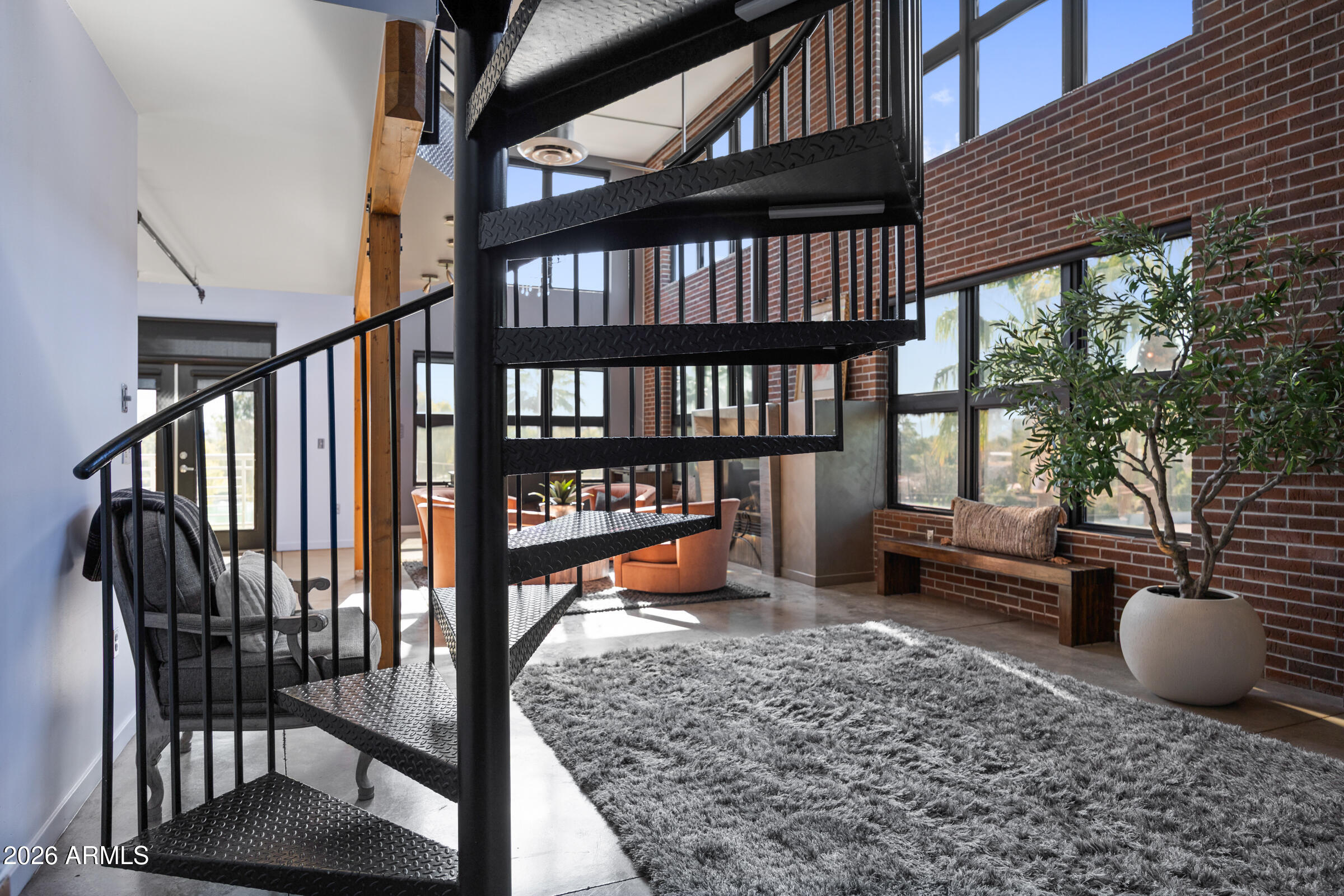 914 East Osborn Road, Unit 403 Phoenix, AZ 85014 - Photo 28 of 49 a view of a porch with chairs and backyard