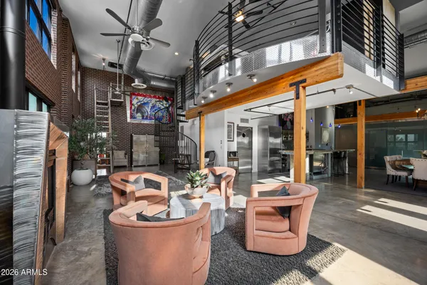 a view of a patio with dining table and chairs and a fire pit