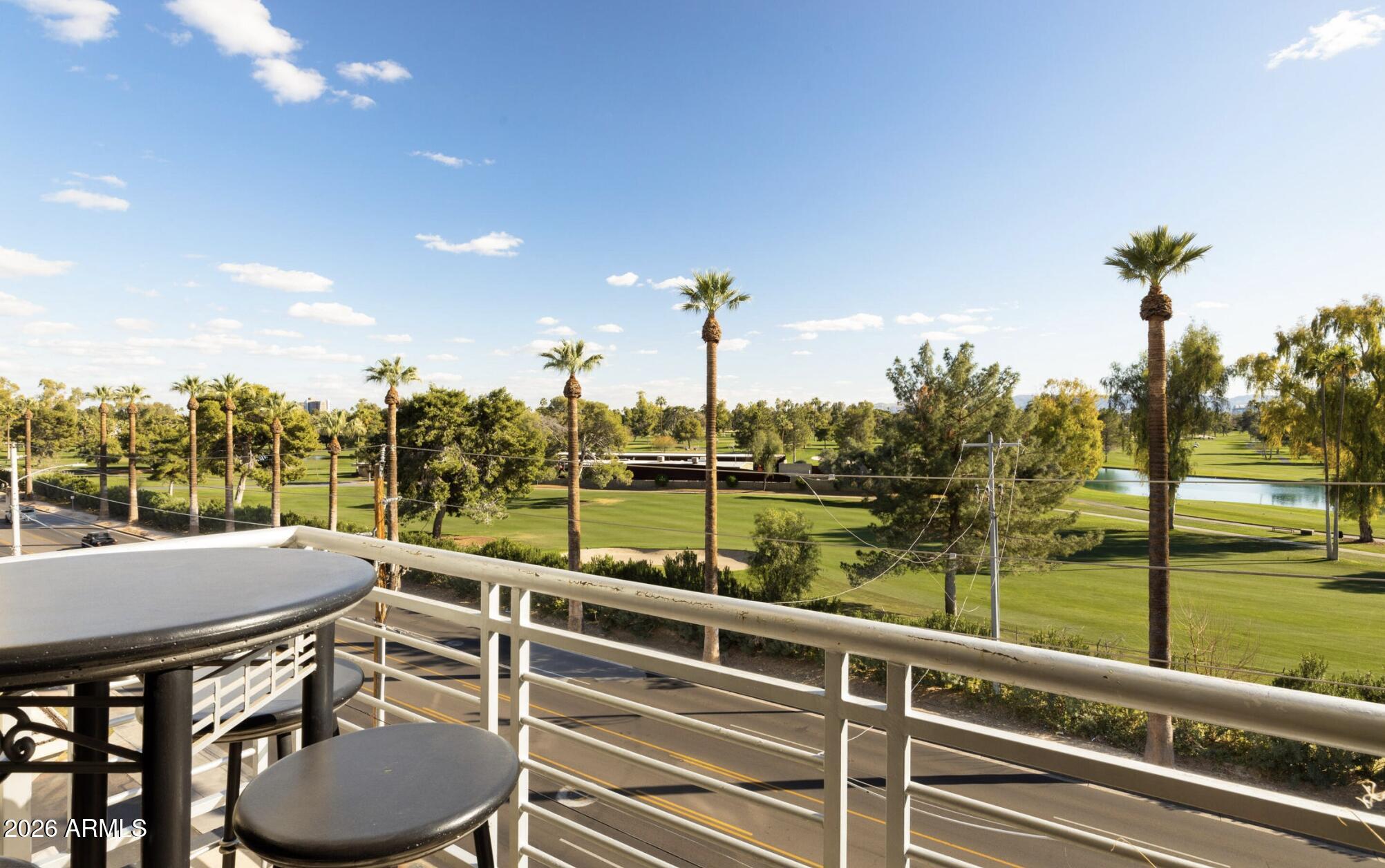 914 East Osborn Road, Unit 403 Phoenix, AZ 85014 - Photo 42 of 49 a view of a lake from a balcony with furniture